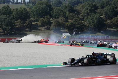 Max Verstappen (NLD) Red Bull Racing RB16 crashes out of the race with Romain Grosjean (FRA) Haas F1 Team VF-20 and Kimi Raikkonen (FIN) Alfa Romeo Racing C39.