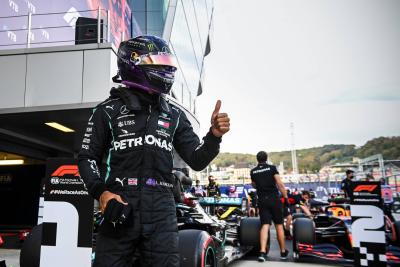 Lewis Hamilton (GBR) Mercedes AMG F1 W11 celebrates his pole position in qualifying parc ferme.