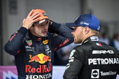 (L to R): Race winner Max Verstappen (NLD) Red Bull Racing with second placed Valtteri Bottas (FIN) Mercedes AMG F1 in parc