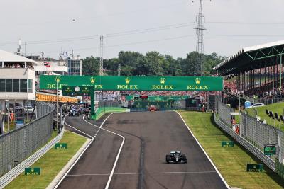 Lewis Hamilton (GBR) Mercedes AMG F1 W12 leads at the restart of the race as every other car