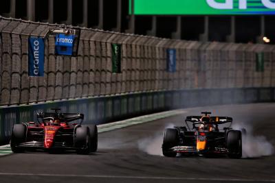 Charles Leclerc (MON) Ferrari F1-75 and Max Verstappen (NLD) Red Bull Racing RB18 battle for the lead of the race.