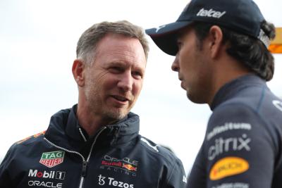 Christian Horner (GBR) Red Bull Racing Team Principal with Sergio Perez (MEX) Red Bull Racing. Formula 1 World