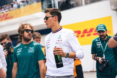 (L to R): Sebastian Vettel (GER) Aston Martin F1 Team with George Russell (GBR) Mercedes AMG F1 on the drivers parade.