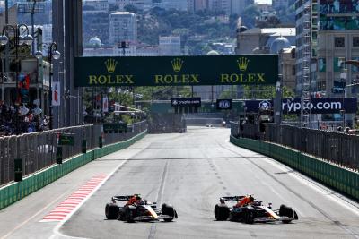 (L to R): Sergio Perez (MEX) Red Bull Racing RB18 is passed for the lead by team mate Max Verstappen (NLD) Red Bull Racing