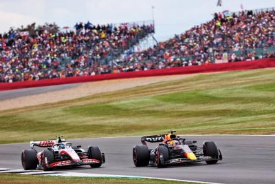 Max Verstappen (NLD) Red Bull Racing RB18 and Mick Schumacher (GER) Haas VF-22 battle for position. Formula 1 World