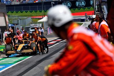 The McLaren MCL36 of Lando Norris (GBR) McLaren is recovered back to the pits by mechanics. Formula 1 World Championship,