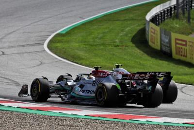 Lewis Hamilton (GBR) Mercedes AMG F1 W13 and Mick Schumacher (GER) Haas VF-22 battle for position. Formula 1 World