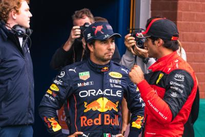 (L to R): Sergio Perez (MEX) Red Bull Racing with Carlos Sainz Jr (ESP) Ferrari in qualifying parc ferme. Formula 1 World