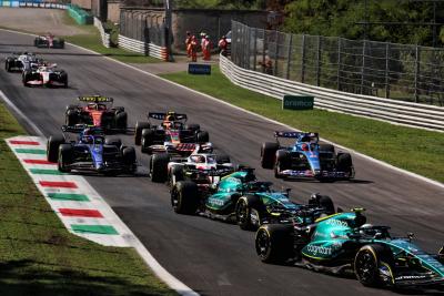 Sebastian Vettel (GER) Aston Martin F1 Team AMR22 and Lance Stroll (CDN) Aston Martin F1 Team AMR22 at the start of the