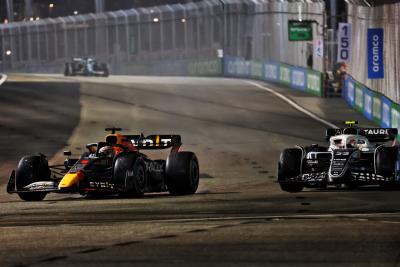 Max Verstappen (NLD) Red Bull Racing RB18 and Yuki Tsunoda (JPN) AlphaTauri AT03 battle for position. Formula 1 World