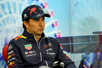 Sergio Perez (MEX) Red Bull Racing, in the post race FIA Press Conference. Formula 1 World Championship, Rd 18, Japanese