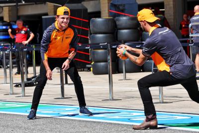 (L to R): Lando Norris (GBR) McLaren with Daniel Ricciardo (AUS) McLaren in the pits. Formula 1 World Championship, Rd 19,