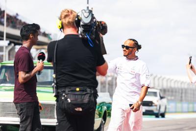 Lewis Hamilton (GBR) Mercedes AMG F1 with Lawrence Barretto (GBR) Formula 1 Senior Writer Editor on the drivers parade.