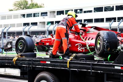 The damaged Ferrari F1-75 of Charles Leclerc (MON) Ferrari is recovered back to the pits on the back of a truck in the