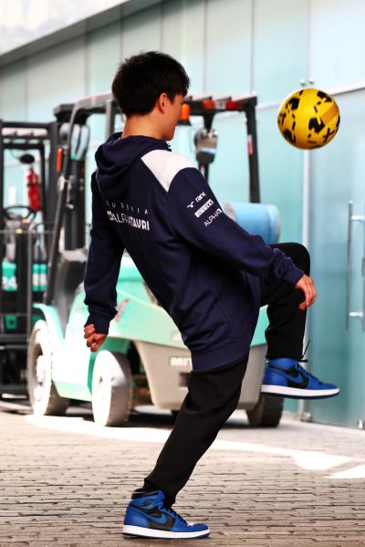 Yuki Tsunoda (JPN) AlphaTauri plays football in the paddock. Formula 1 World Championship, Rd 21, Brazilian Grand Prix,