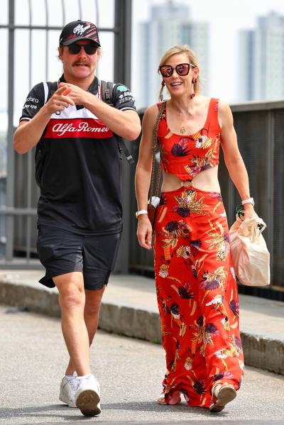 (L to R): Valtteri Bottas (FIN) Alfa Romeo F1 Team with his girlfriend Tiffany Cromwell (AUS) Professional Cyclist.