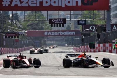 (L to R): Charles Leclerc (MON) Ferrari SF-23 and Sergio Perez (MEX) Red Bull Racing RB19 battle for position. Formula 1