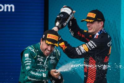 (L to R): Fernando Alonso (ESP) Aston Martin F1 Team celebrates his second position on the podium with race winner Max