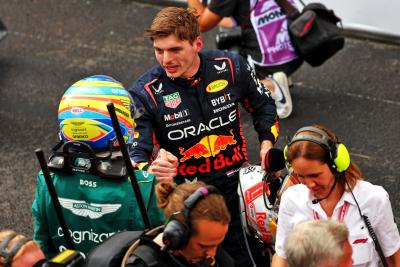 Race winner Max Verstappen (NLD) Red Bull Racing with second placed Fernando Alonso (ESP) Aston Martin F1 Team in parc