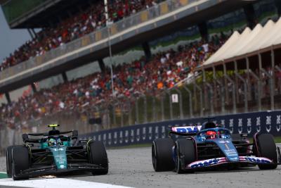 Esteban Ocon (FRA) Alpine F1 Team A523 and Fernando Alonso (ESP) Aston Martin F1 Team AMR23 battle for position. Formula 1