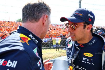 Sergio Perez (MEX) Red Bull Racing (Right) with Christian Horner (GBR) Red Bull Racing Team Principal on the grid. Formula