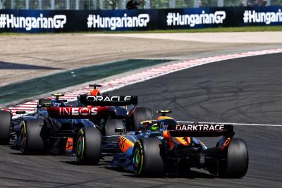 Max Verstappen (NLD) Red Bull Racing RB19 leads Lewis Hamilton (GBR) Mercedes AMG F1 W14 and Lando Norris (GBR) McLaren