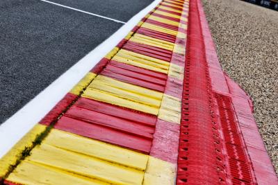 Circuit atmosphere - La Source exit kerb. Formula 1 World Championship, Rd 13, Belgian Grand Prix, Spa Francorchamps,