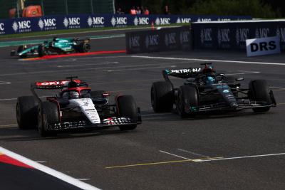 Daniel Ricciardo (AUS) AlphaTauri AT04 and George Russell (GBR) Mercedes AMG F1 W14 battle for position. Formula 1 World