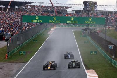 Sergio Perez (MEX) Red Bull Racing RB19 and Lewis Hamilton (GBR) Mercedes AMG F1 W14 battle for position. Formula 1 World