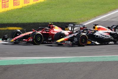 Carlos Sainz Jr (ESP) Ferrari SF-23 and Max Verstappen (NLD) Red Bull Racing RB19 battle for the lead of the race. Formula