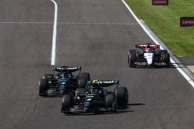 Lewis Hamilton (GBR) Mercedes AMG F1 W14 and team mate George Russell (GBR) Mercedes AMG F1 W14 battle for position.
