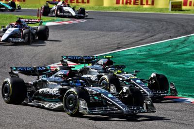 (L to R): George Russell (GBR) Mercedes AMG F1 W14 and team mate Lewis Hamilton (GBR) Mercedes AMG F1 W14 battle for