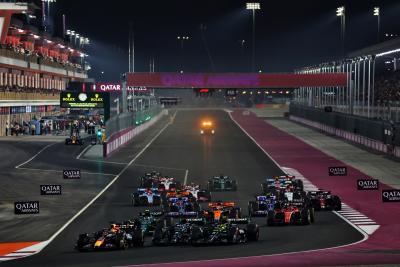Max Verstappen (NLD) Red Bull Racing RB19 leads George Russell (GBR) Mercedes AMG F1 W14 and Lewis Hamilton (GBR) Mercedes