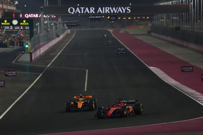 Charles Leclerc (MON) Ferrari SF-23 leads Lando Norris (GBR) McLaren MCL60. Formula 1 World Championship, Rd 18, Qatar