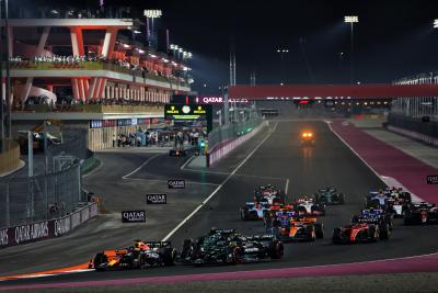 Max Verstappen (NLD) Red Bull Racing RB19 leads at the start of the race as George Russell (GBR) Mercedes AMG F1 W14 and