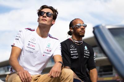 (L to R): George Russell (GBR) Mercedes AMG F1 and Lewis Hamilton (GBR) Mercedes AMG F1 on the drivers' parade. Formula 1