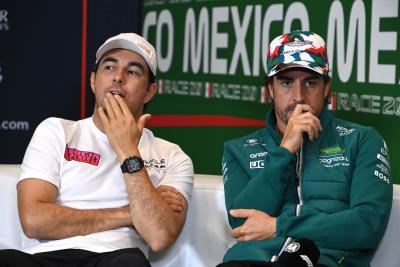 (L to R): Sergio Perez (MEX) Red Bull Racing and Fernando Alonso (ESP) Aston Martin F1 Team in the FIA Press Conference.
