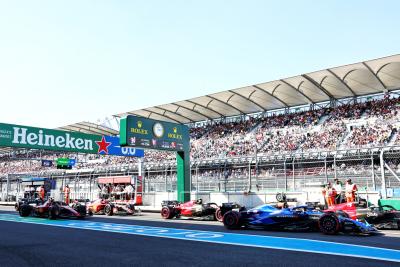 Carlos Sainz Jr (ESP) Ferrari SF-23 passes the stationary Valtteri Bottas (FIN) Alfa Romeo F1 Team C43; Logan Sargeant (USA)