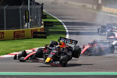 Charles Leclerc (MON) Ferrari SF-23 and Sergio Perez (MEX) Red Bull Racing RB19 - crash at the start of the race. Formula