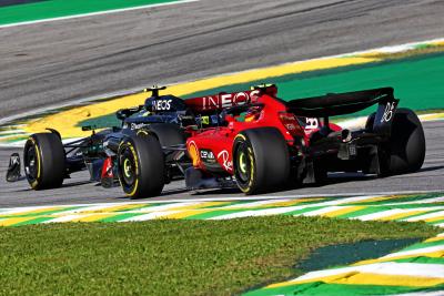 Lewis Hamilton (GBR) Mercedes AMG F1 W14 leads Carlos Sainz Jr (ESP) Ferrari SF-23. Formula 1 World Championship, Rd 21,