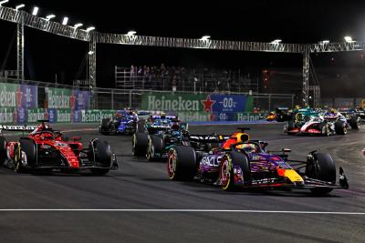 Max Verstappen (NLD) Red Bull Racing RB19 leads Charles Leclerc (MON) Ferrari SF-23 at the start of the race. Formula 1