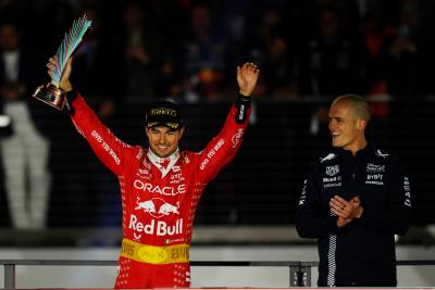 Sergio Perez (MEX) Red Bull Racing celebrates his third position on the podium. Formula 1 World Championship, Rd 22, Las