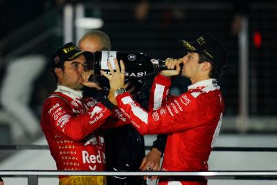 (L to R): Sergio Perez (MEX) Red Bull Racing celebrates his third position on the podium with second placed Charles Leclerc