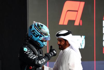 (L to R): George Russell (GBR) Mercedes AMG F1 with Mohammed Bin Sulayem (UAE) FIA President in qualifying parc ferme.