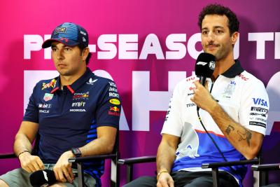 (L to R): Sergio Perez (MEX) Red Bull Racing and Daniel Ricciardo (AUS) RB in the FIA Press Conference. Formula 1 Testing,