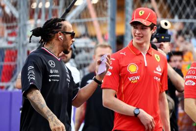 (L to R): Lewis Hamilton (GBR) Mercedes AMG F1 and Oliver Bearman (GBR) Ferrari Reserve Driver on the drivers' parade.