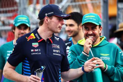 (L to R): Max Verstappen (NLD) Red Bull Racing and Fernando Alonso (ESP) Aston Martin F1 Team on the drivers' parade.