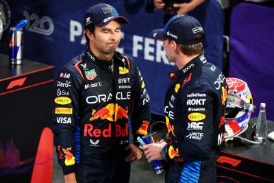 (L to R): Second placed Sergio Perez (MEX) Red Bull Racing and race winner Max Verstappen (NLD) Red Bull Racing in parc