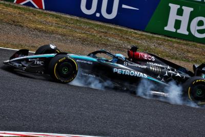 George Russell (GBR) Mercedes AMG F1 W15 locks up under braking. Formula 1 World Championship, Rd 4, Japanese Grand Prix,