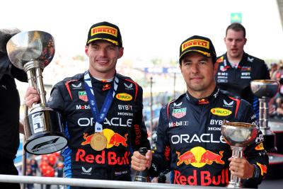 (L to R): Race winner Max Verstappen (NLD) Red Bull Racing celebrates on the podium with second placed team mate Sergio